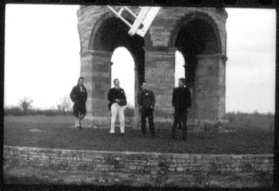 grainy black and white print of posing near Chesterton windmill